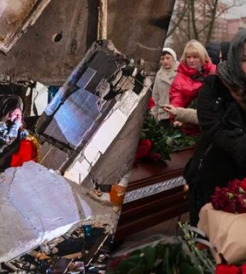 У Дніпрі попрощалися з батьками дівчини, фото якої на руїнах багатоповерхівки облетіло світ