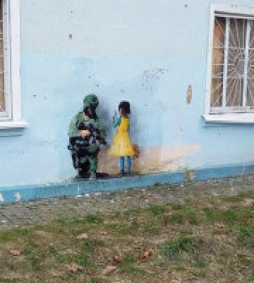 Італійський художник намалював у Бучі вуличне графіті