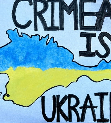 В Севастополе задержали женщину за проукраинские надписи на заборе