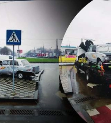 У Чернівцях старенький ВАЗ покинули на острівці безпеки посеред дороги: довелося викликати кран