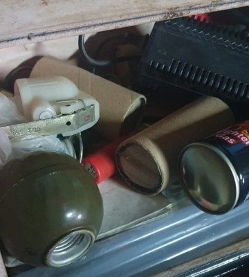 Зберігав набої, гранату та наркозілля -  поліцейські затримали мешканця Первомайського району