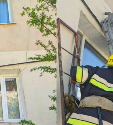 На Одещині 9-річна дівчинка вилізла з вікна багатоквартирного будинку і стояла на скрутці інтернет-кабелів, - ФОТО