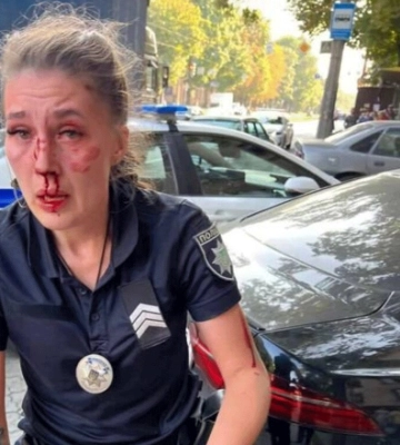 Стрельба в Днепре: женщина, которая была в машине, напала на патрульную со спины (видео)