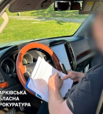 У Харкові на хабарі у $1500 погорів доглядач кладовища, фото