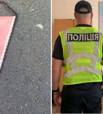 У Києві чоловік розвісив десятки радянських прапорців на паркані гімназії