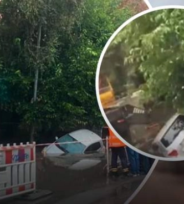 В Киеве под асфальт провалился автомобиль