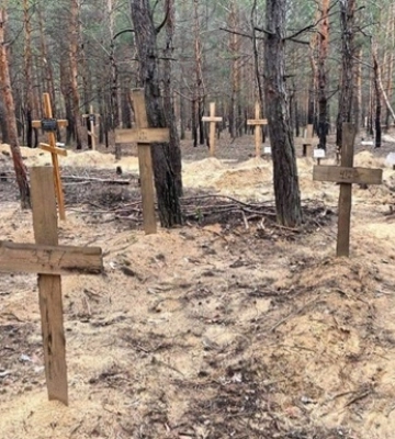 В Изюме начались процессуальные действия в отношении массовых захоронений - Зеленский