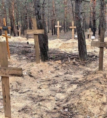 На месте массового захоронения в Изюме эксгумировали уже более 90 тел
