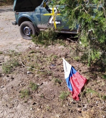 Російська влада насипає український борщ на похоронах військових (документ) 