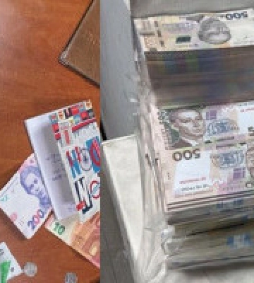 Група шахраїв у Києві ошукували громадян під прикриттям фейкових пунктів обміну валют (фото, відео)