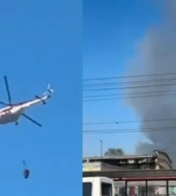 Пожежа на Почайній внаслідок обстрілу: вогонь на господарському ринку гасять вертольоти (відео)