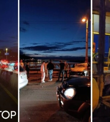 BMW протаранив тролейбус на мосту Патона: юнаки влаштували фотосесію біля розбитої автівки